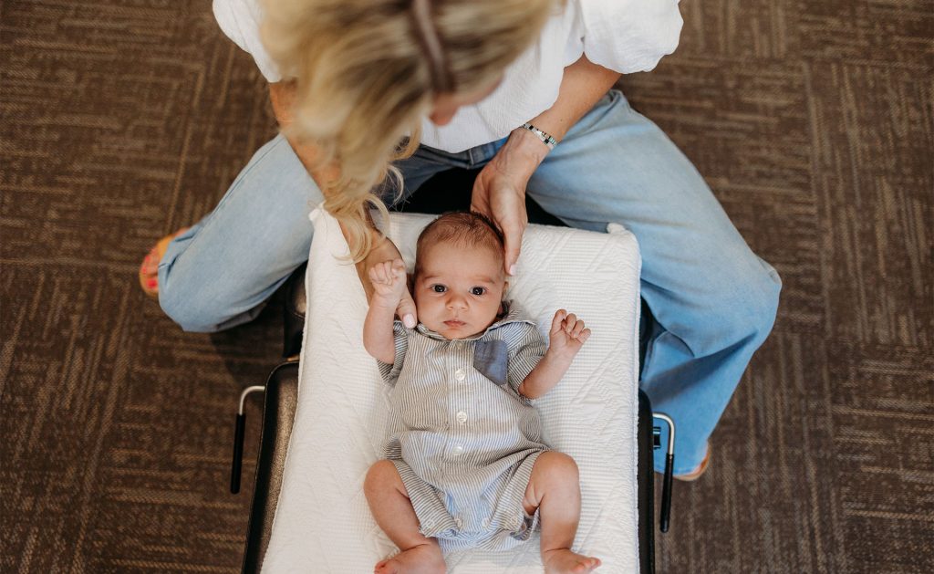Pediatric Chiropractor, Dr. Lauren Zokan, gently evaluates a baby's torticollis